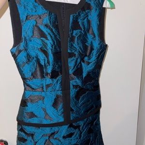 BCBG Max Azria size 0 peplum dress. Black with shiny blue feather design. Worn1x